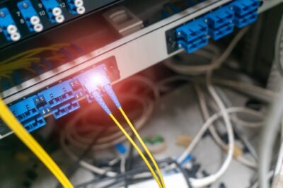Fiber-optic cables connected to networking equipment