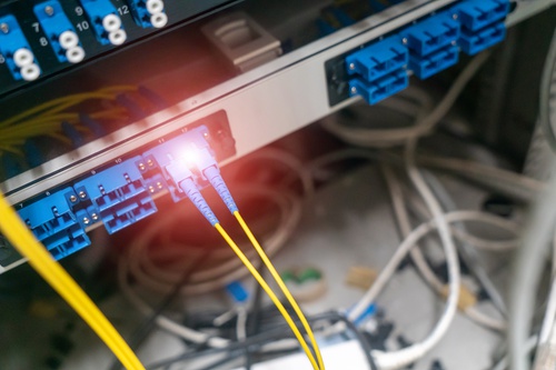 Fiber-optic cables connected to networking equipment