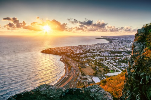 Sunrise over Saint-Denis, Reunion, illustrating the ReuNION subsea cable project