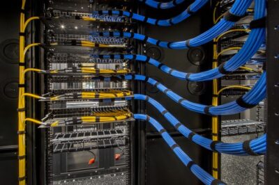 Fiber-optic and network cabling inside a data center, illustrating the Toptana Washington cable landing station