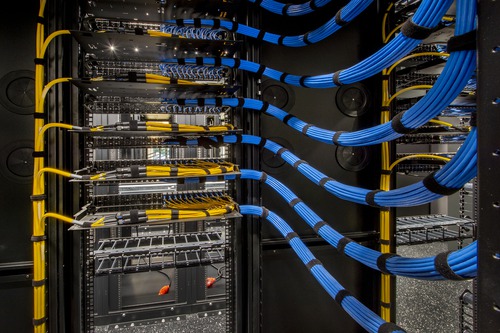 Fiber-optic and network cabling inside a data center, illustrating the Toptana Washington cable landing station
