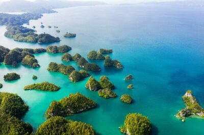 Aerial view of green islands and turquoise sea in Indonesia