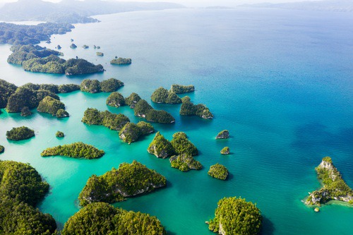 Aerial view of green islands and turquoise sea in Indonesia