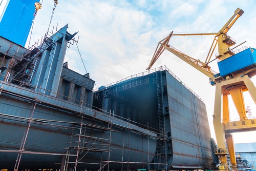 New vessel hull under construction at a shipyard, illustrating the CS Resilience keel-laying milestone
