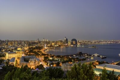 Baku waterfront skyline beside the Caspian Sea at dusk